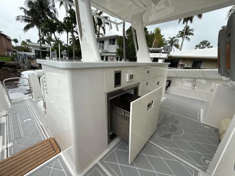 Slide: The Image of 2021 Regal 38 SAV boat interior with open storage, sleek design, and modern amenities. - 13