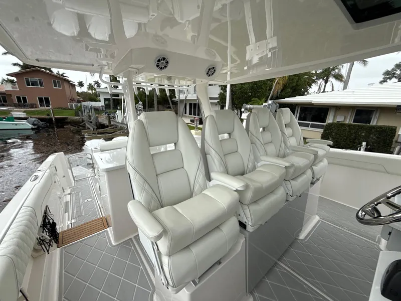Slide: The Image of 2021 Regal 38 SAV boat with luxurious white seating and modern design. - 20
