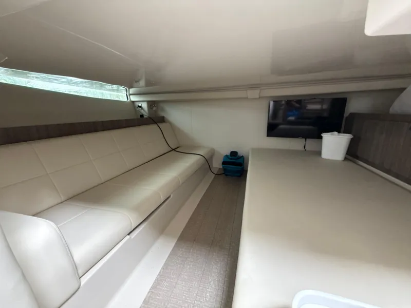 Slide: The Image of Interior of 2021 Regal 38 SAV yacht with seating and TV. - 28
