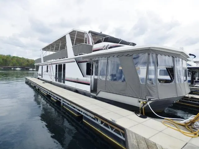 Slide: The Image of Houseboat docked on calm water, Fantasy 17x85 model, 1998, with covered upper deck. - 0
