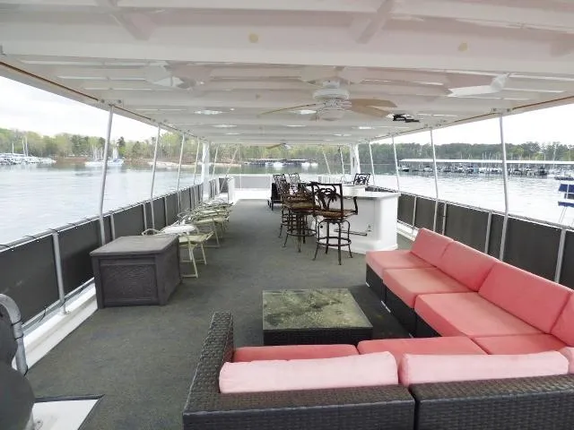 Slide: The Image of Spacious deck of 1998 Fantasy 17x85 houseboat with seating and bar area. - 12