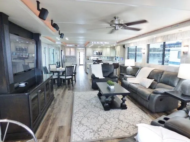 Slide: The Image of Luxurious houseboat interior with modern furnishings, spacious living area, and elegant decor. - 2