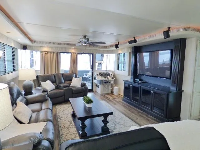 Slide: The Image of Luxurious houseboat interior with leather sofas, large TV, and elegant decor, Fantasy 17x85 model, 1998. - 3