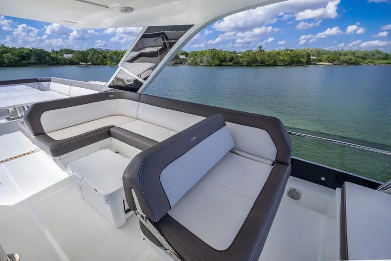 Slide: The Image of Luxurious seating area on 2020 Galeon 640 Fly yacht overlooking serene waters. - 18