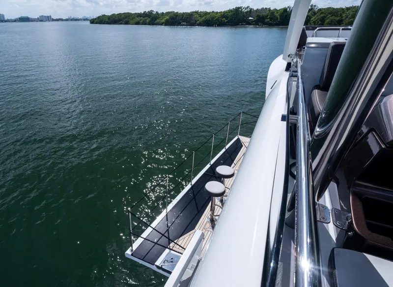 Slide: The Image of 2020 Galeon 640 Fly yacht with scenic water view and sleek deck design. - 19