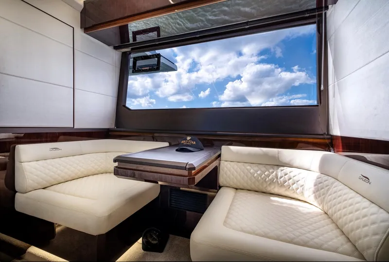 Slide: The Image of Luxurious interior of 2020 Galeon 640 Fly yacht with plush seating and large window view. - 33