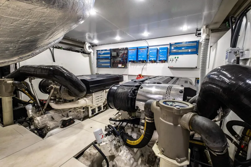 Slide: The Image of Engine room of 2020 Galeon 640 Fly yacht, featuring advanced machinery and control panels. - 45