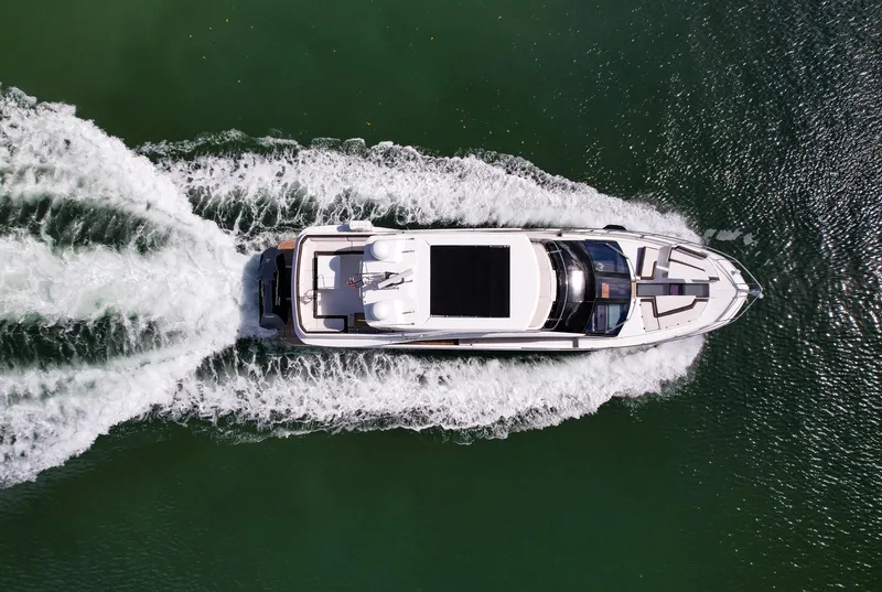 Slide: The Image of Aerial view of 2020 Galeon 640 Fly yacht cruising on water. - 5