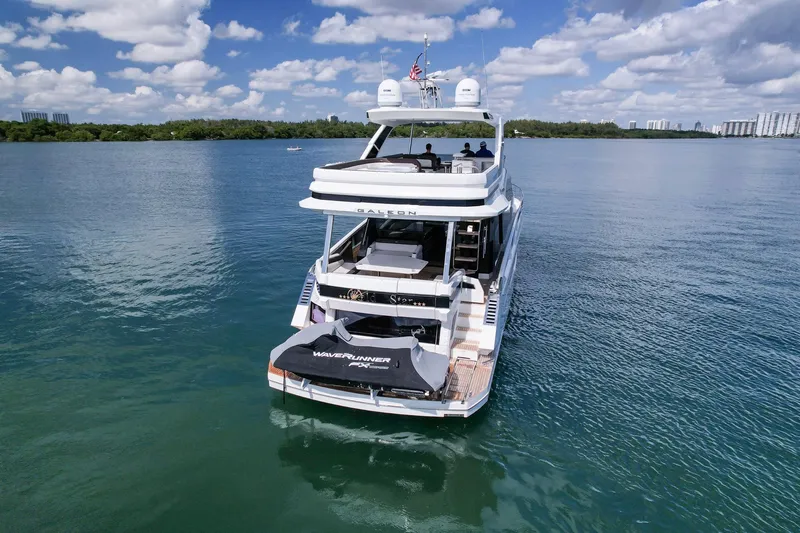 Slide: The Image of 2020 Galeon 640 Fly yacht on calm water under a partly cloudy sky. - 7