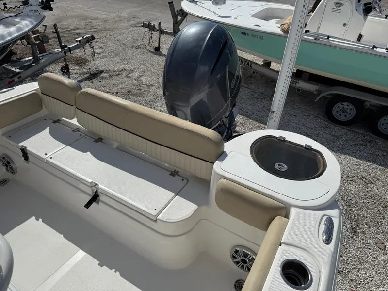 Slide: The Image of 2018 Sea Fox 226 Commander boat interior with seating and motor. - 3