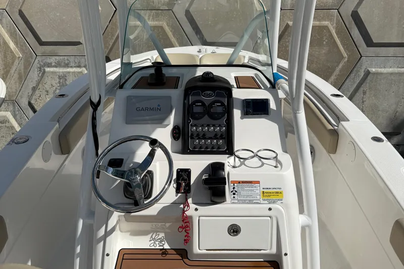 Slide: The Image of 2018 Sea Fox 226 Commander boat dashboard with steering wheel and Garmin navigation system. - 6