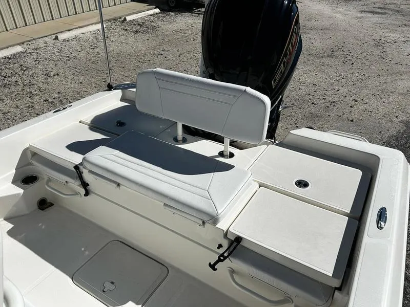 Slide: The Image of 2024 Skeeter SX230 boat interior with white seating and storage compartments. - 15