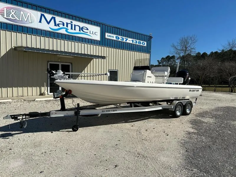Slide: The Image of 2024 Skeeter SX230 boat on trailer outside marine dealership. - 4