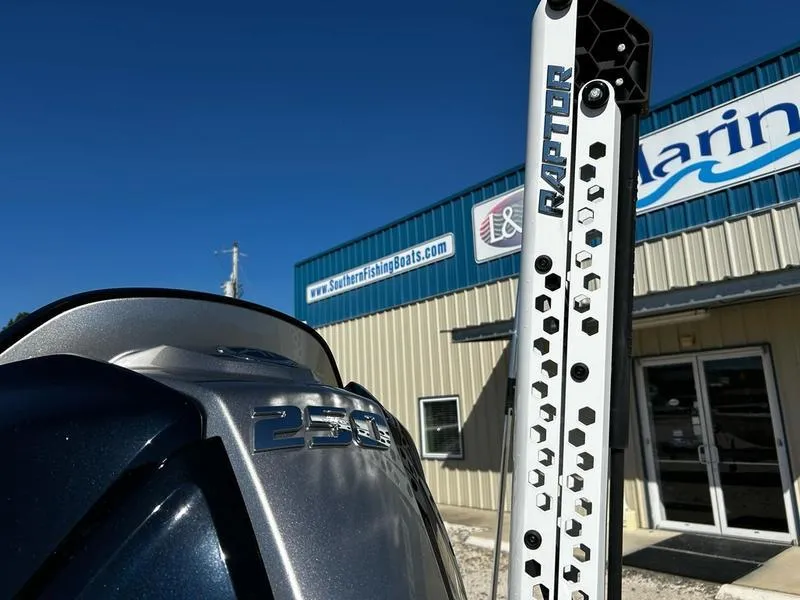 Slide: The Image of 2024 Skeeter SX230 boat with Raptor anchor, outside a marine store. - 9