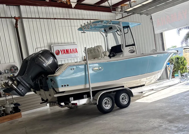 Slide: The Image of 2018 Sea Hunt Gamefish 25 boat on trailer in garage with Yamaha engine. - 5
