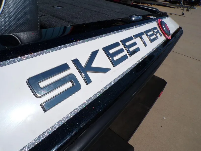 Slide: The Image of 2024 Skeeter ZX150 boat logo on sleek exterior design. - 11