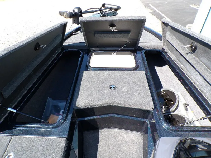 Slide: The Image of 2024 Skeeter ZX150 boat storage compartments with open hatches, showcasing ample space and organization. - 16