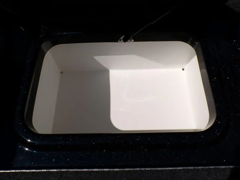 Slide: The Image of 2024 Skeeter ZX150 livewell, open and empty, with a white interior. - 20