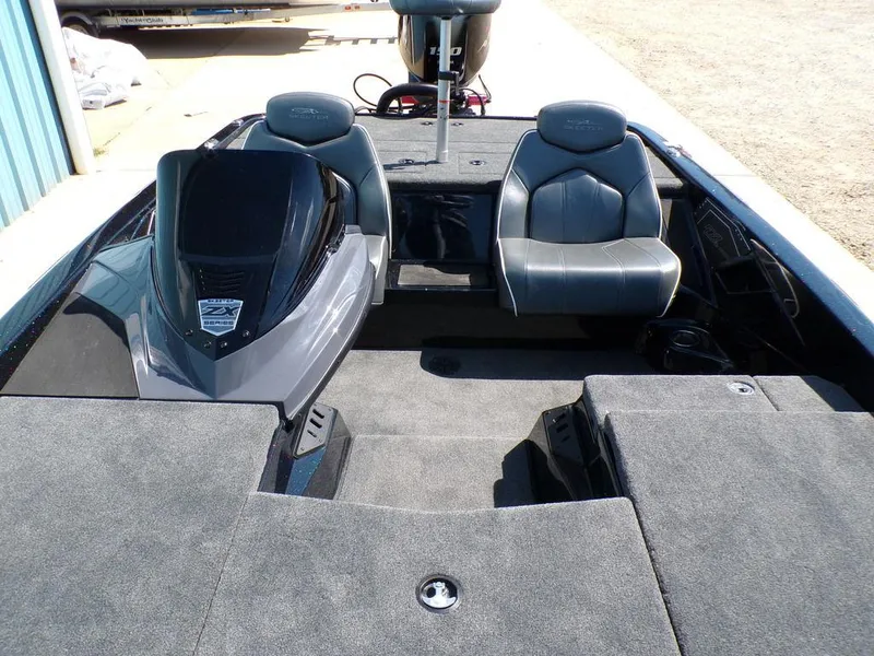 Slide: The Image of 2024 Skeeter ZX150 boat interior with dual seats and carpeted deck. - 22