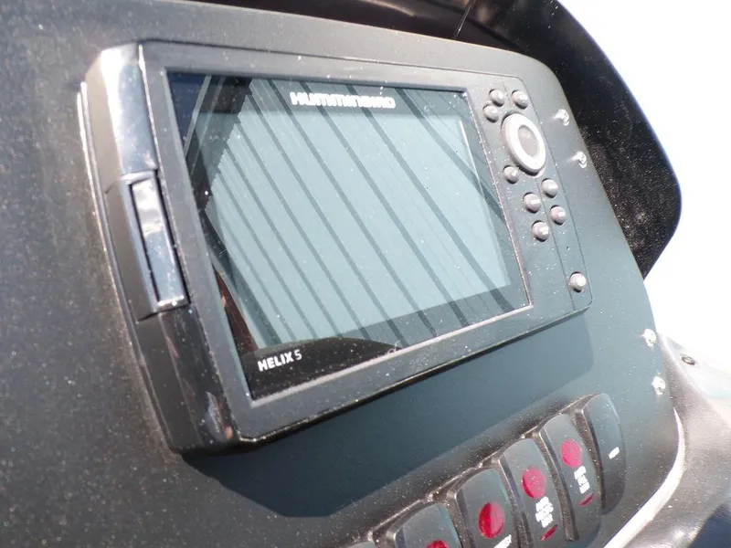 Slide: The Image of 2024 Skeeter ZX150 dashboard featuring a Humminbird Helix 5 fish finder. - 27