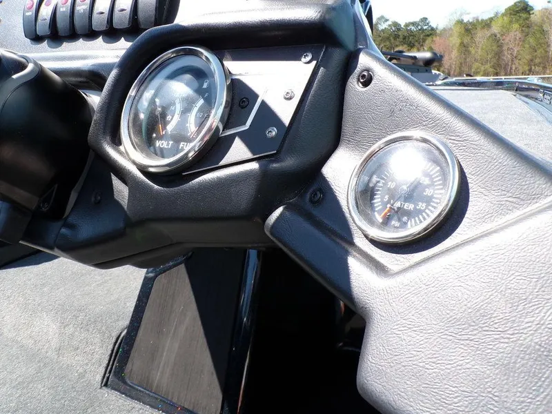 Slide: The Image of 2024 Skeeter ZX150 dashboard with volt and water temperature gauges. - 28