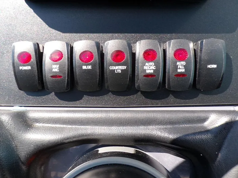 Slide: The Image of 2024 Skeeter ZX150 dashboard switches, including power, bilge, and horn controls. - 30