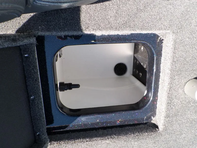 Slide: The Image of 2024 Skeeter ZX150 boat storage compartment with open hatch, showcasing interior details. - 31
