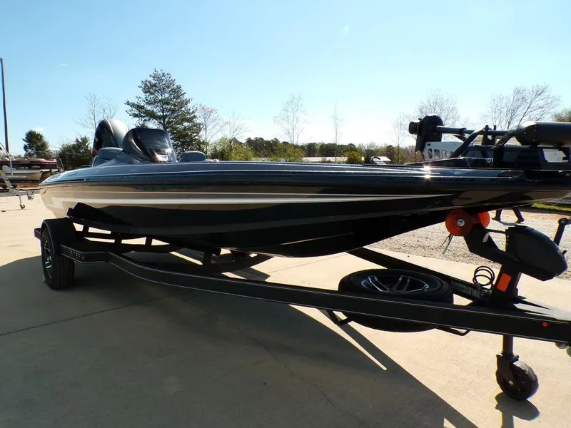 Slide: The Image of 2024 Skeeter ZX150 boat on trailer, parked outdoors on a sunny day. - 6