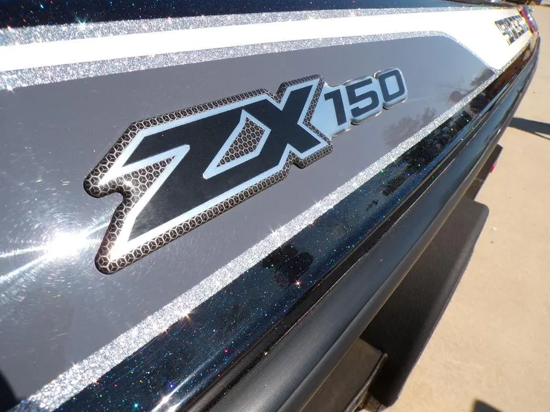 Slide: The Image of 2024 Skeeter ZX150 boat logo with sleek design and metallic finish. - 9