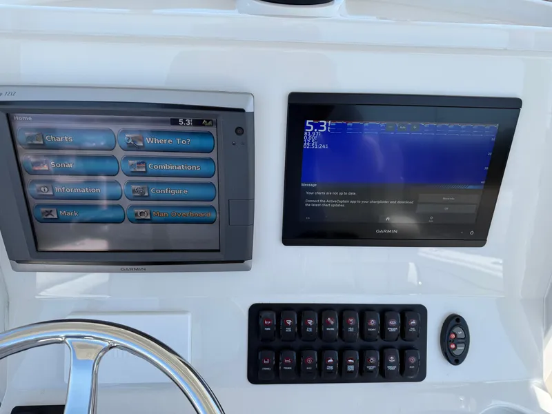 Slide: The Image of Boat dashboard with dual screens and control panel, Jupiter 26, 2016 model. - 18