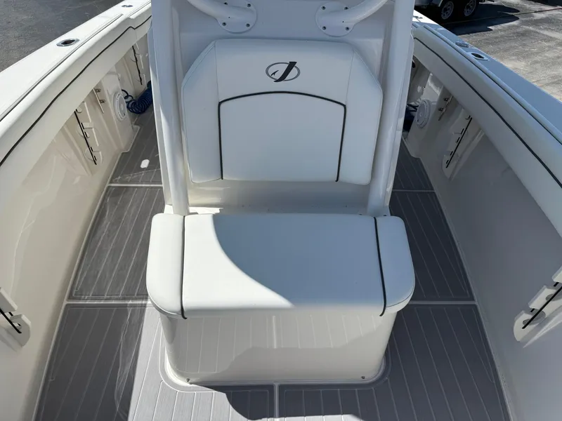 Slide: The Image of 2016 Jupiter 26 boat interior with white seating and sleek design. - 23