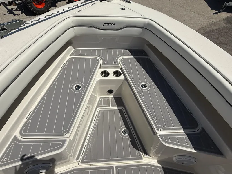 Slide: The Image of 2016 Jupiter 26 boat deck with gray non-slip surface and seating area. - 24