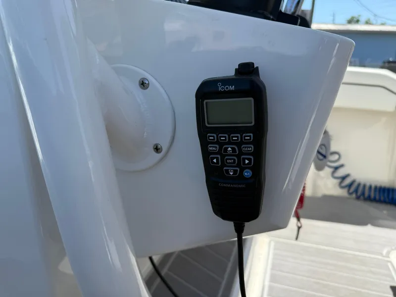 Slide: The Image of Minn Kota i-Pilot trolling motor on a 2016 Jupiter 26 boat, outdoor setting. - 6