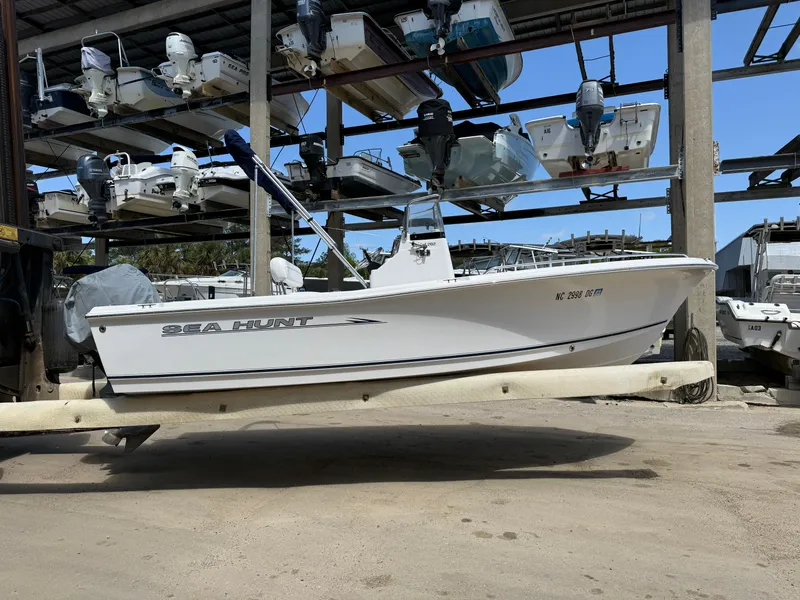 Slide: The Image of 2007 Sea Hunt 202 TRITON boat in storage, surrounded by other vessels. - 13