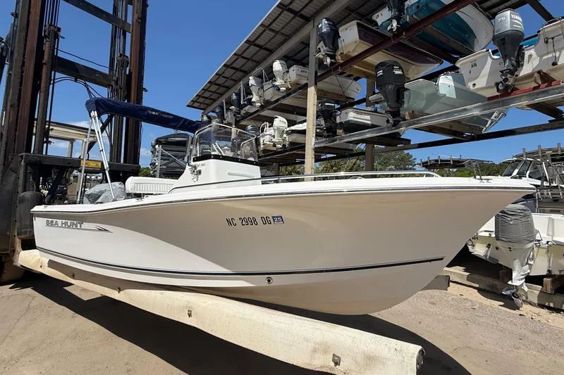 Slide: The Image of 2007 Sea Hunt 202 TRITON boat in storage, white hull, outdoor setting. - 2
