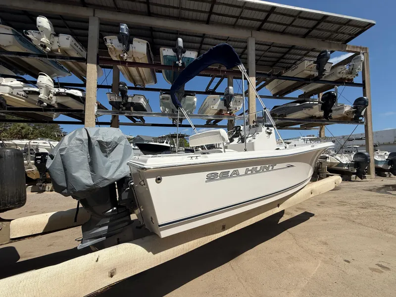 Slide: The Image of 2007 Sea Hunt 202 TRITON boat in storage, covered and elevated. - 4