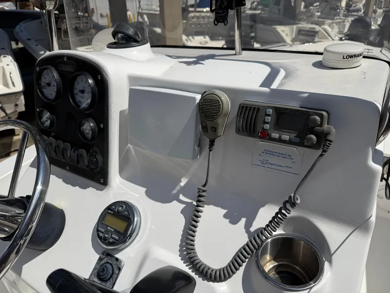 Slide: The Image of Control panel of 2007 Sea Hunt 202 TRITON boat with gauges and radio equipment. - 6