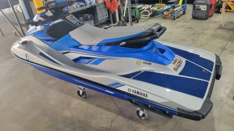 Slide: The Image of 2020 Yamaha WaveRunner EX Deluxe in a garage setting. - 11