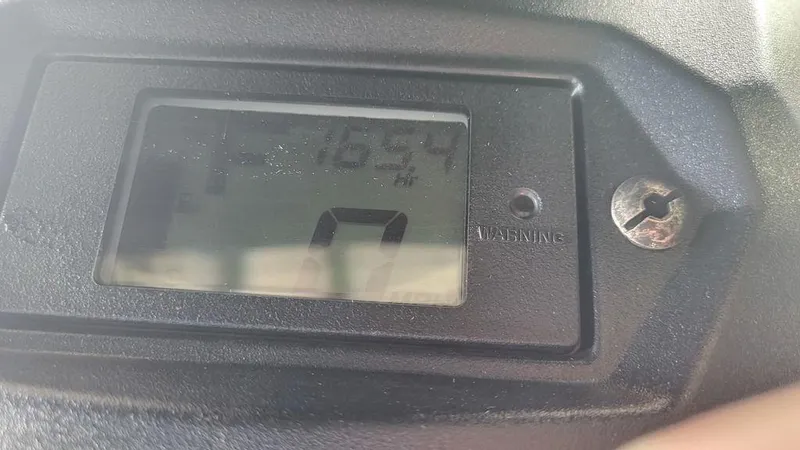 Slide: The Image of Close-up of 2020 Yamaha WaveRunner EX Deluxe digital display showing 1654 hours. - 4