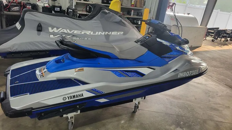 Slide: The Image of 2020 Yamaha WaveRunner EX Deluxe in a garage, blue and white design. - 6
