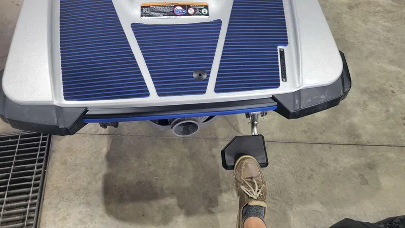 Slide: The Image of 2020 Yamaha WaveRunner EX Deluxe rear view with foot on step, indoors. - 8