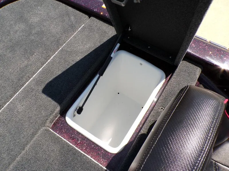 Slide: The Image of 2024 Skeeter ZX150 boat storage compartment with open lid, showcasing interior space. - 22