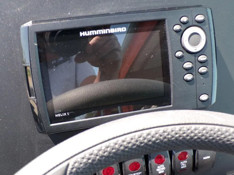 Slide: The Image of Humminbird Helix 5 fish finder on 2024 Skeeter ZX150 dashboard. - 3