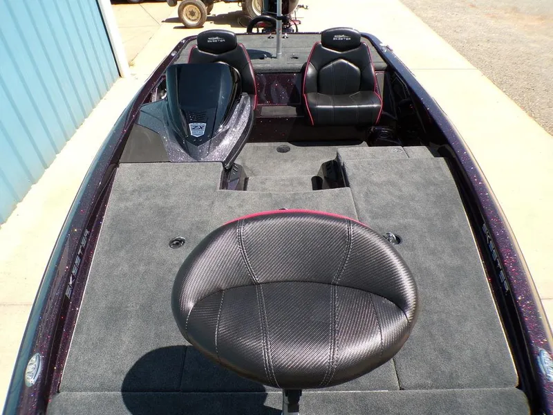 Slide: The Image of 2024 Skeeter ZX150 boat interior with seating and carpeted deck. - 6