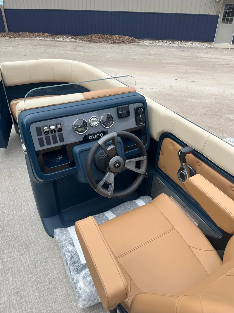 Slide: The Image of 2025 Avalon Aura 21 boat interior with tan seating and modern dashboard controls. - 3