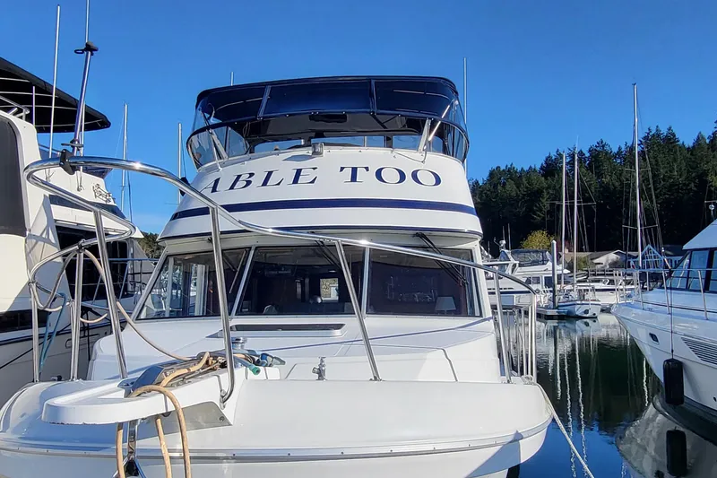 The Image of Corsair 42 yacht from 1992 docked in a marina, clear blue sky background. - 0