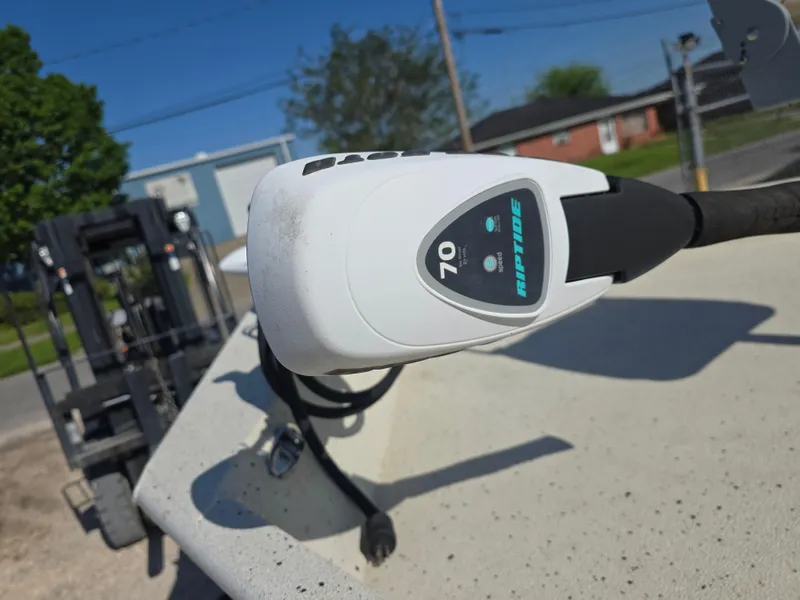 Slide: The Image of Xpress H20B 2013 boat control panel with digital display in outdoor setting. - 10