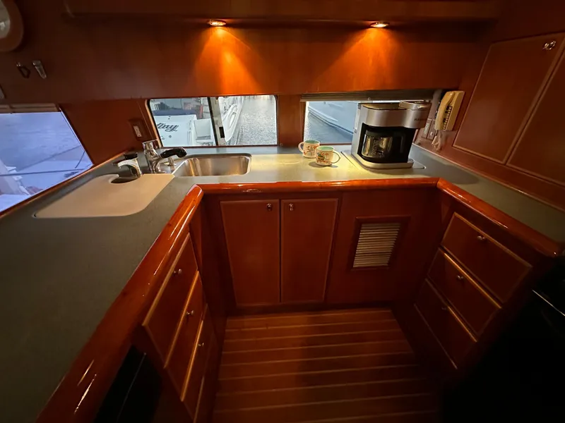 Slide: The Image of Luxurious kitchen interior of a 1999 Mikelson Long-Range Luxury Sportfish yacht. - 15