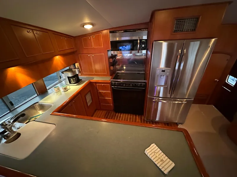 Slide: The Image of Luxurious kitchen interior of a 1999 Mikelson Long-Range Luxury Sportfish yacht. - 16