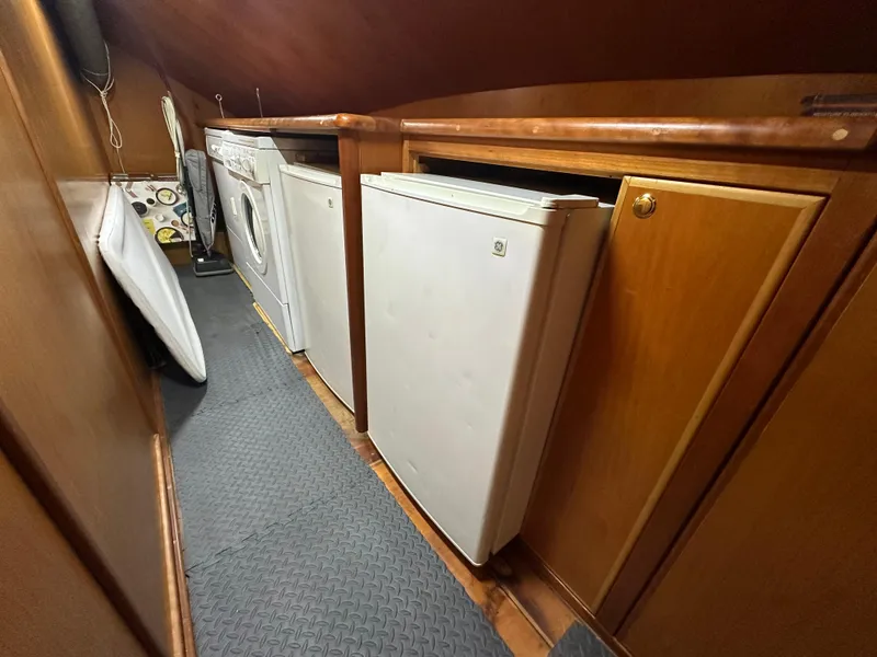 Slide: The Image of Laundry area in 1999 Mikelson Long-Range Luxury Sportfish yacht with washer and dryer. - 17